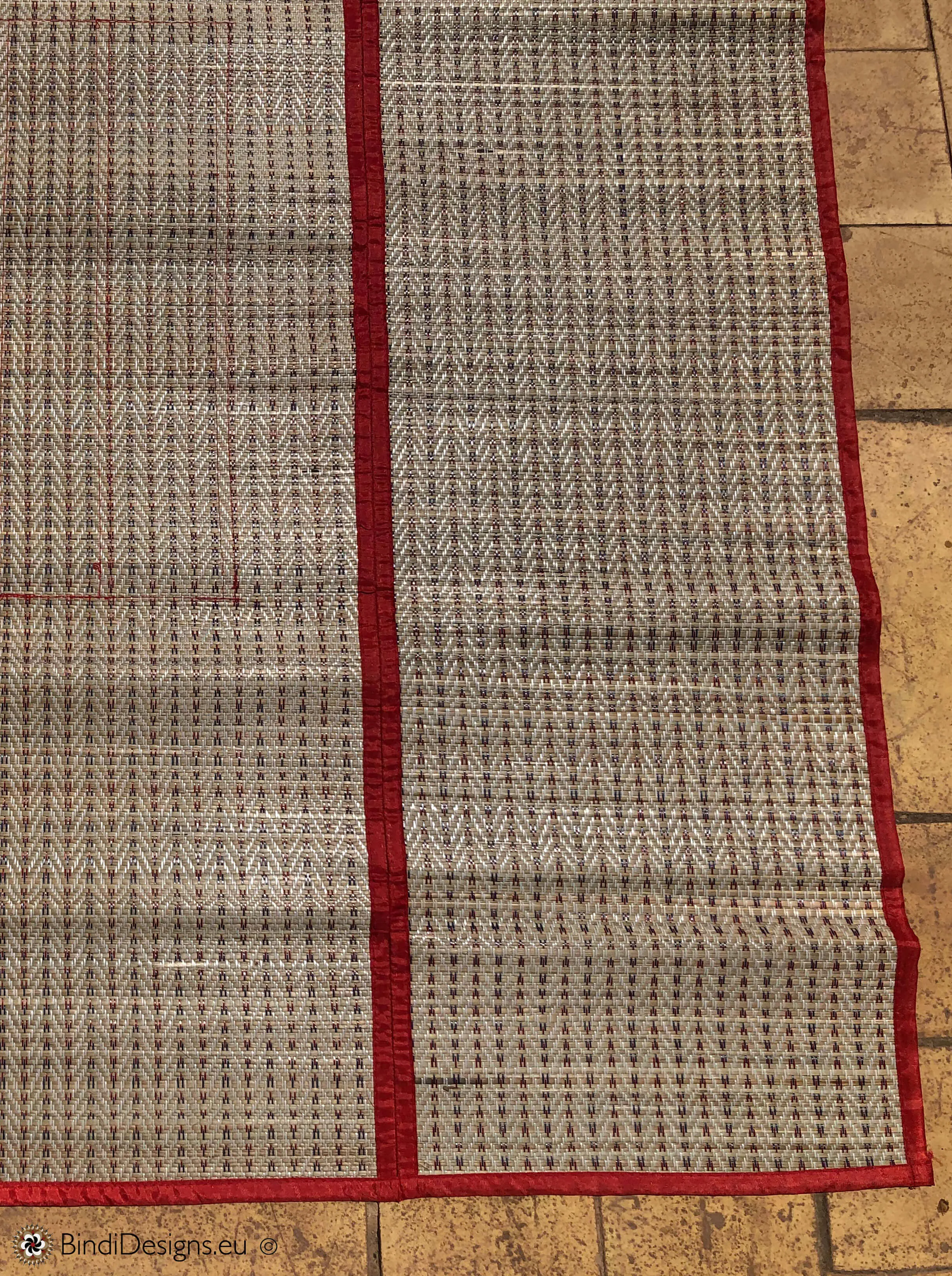 Handwoven Natural Reed Fold up Mat with Red Trim